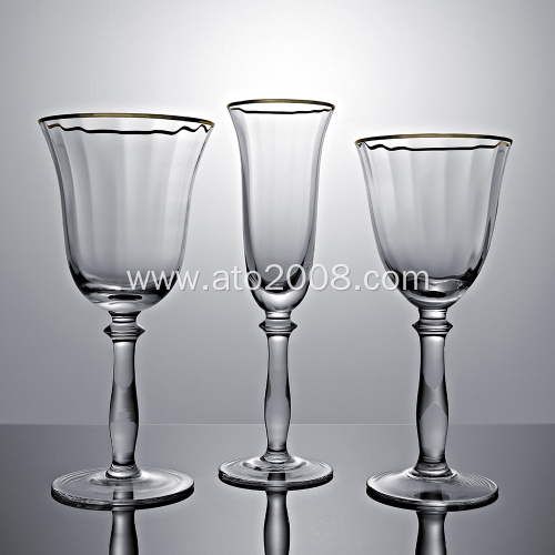 Gold rimmed crystal champagne flutes